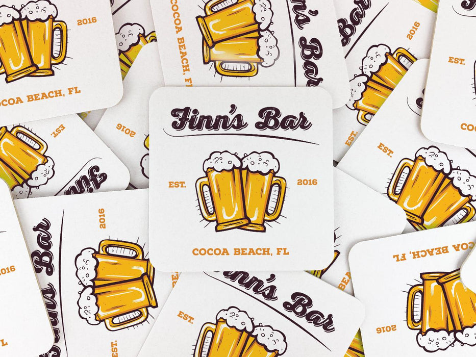 A stack of coasters are spread out across a surface. Coasters feature bar design. This design uses brown and orange lettering, and a drawing of beer glasses. The name, established date, and location can be customized.