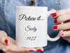 woman with red nail polish holding a white mug with golden girls inspired typography design with quote that says Picture it...Sicily 1922