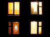 Haunted Welcome Home sticker (in white) is shown stuck to the exterior of an apartment window.