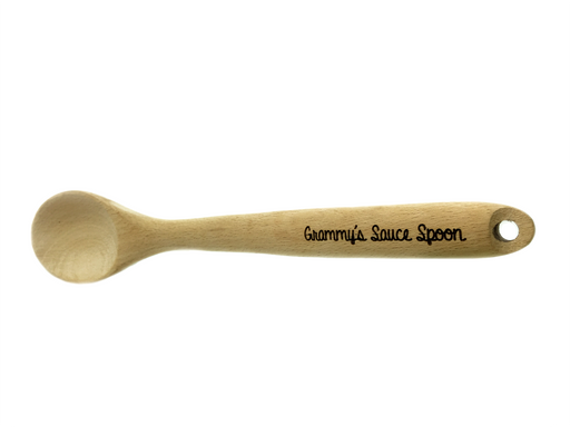 Laser engraved wooden spoon that says Grammys Sauce Spoon on handle against white background