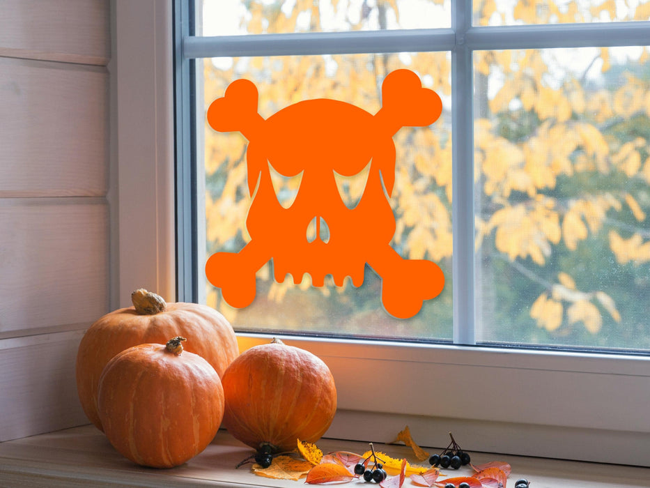 Skull and Crossbones sticker (in orange) is shown stuck to the interior of a window.