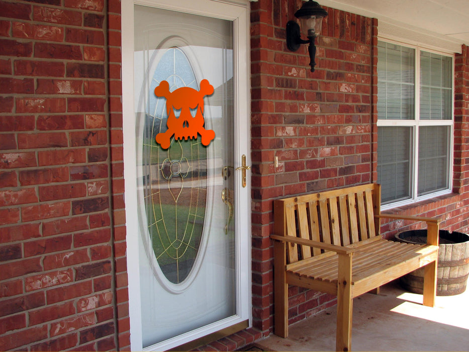 Skull and Crossbones sticker (in orange) is shown stuck to the exterior of a window.