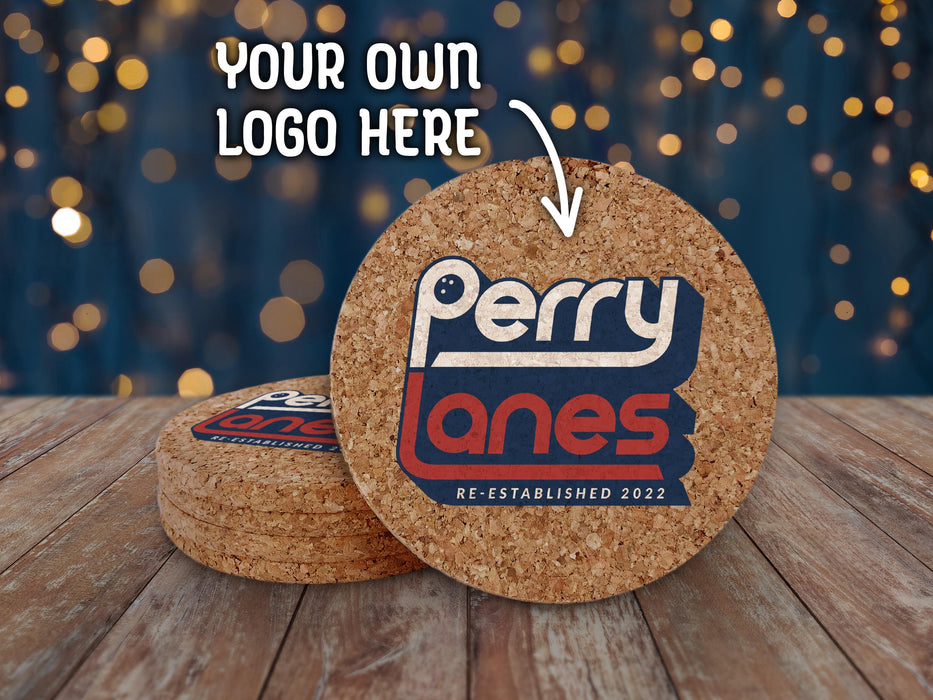 Your own logo here and an arrow points toward custom cork logo coasters. A stack of coasters sit on a wood surface in front of a blue background.