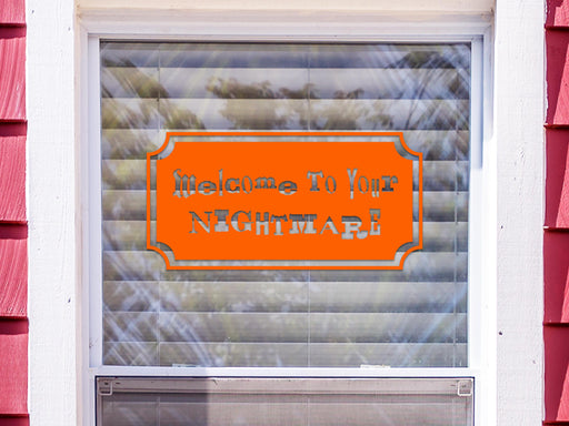 Welcome To Your Nightmare sticker (in orange) is shown stuck to the exterior of a window.