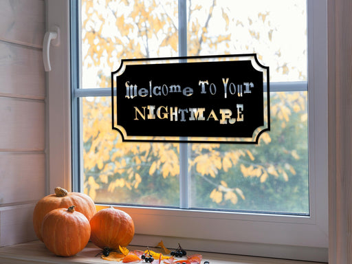 Welcome To Your Nightmare sticker (in black) is shown stuck to the interior of a window.