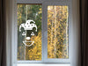 Jester sticker (in white) is shown stuck to the interior of a window.