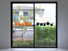 Pumpkin Patch sticker (in orange and black) is shown stuck to the interior of a glass door.