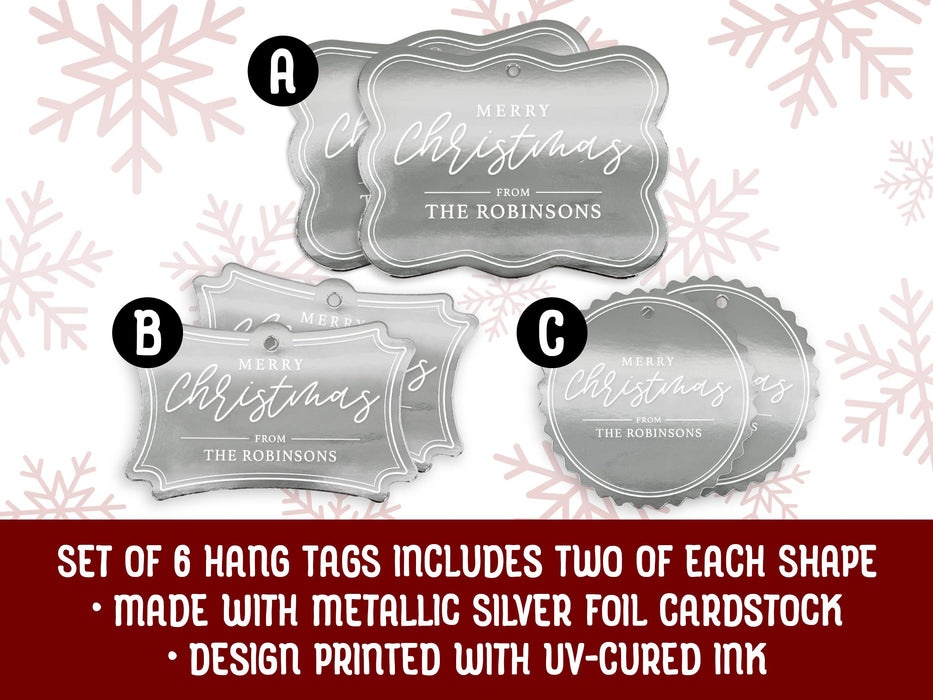 Hang tags on a white background with red snowflakes. Text reads: Set of 6 hang tags includes two of each shape. Made with metallic silver foil cardstock. Design printed with uv-cured ink.