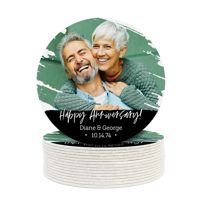 A stack of Happy Anniversary coasters with a picture of an older man and woman and custom text on it.