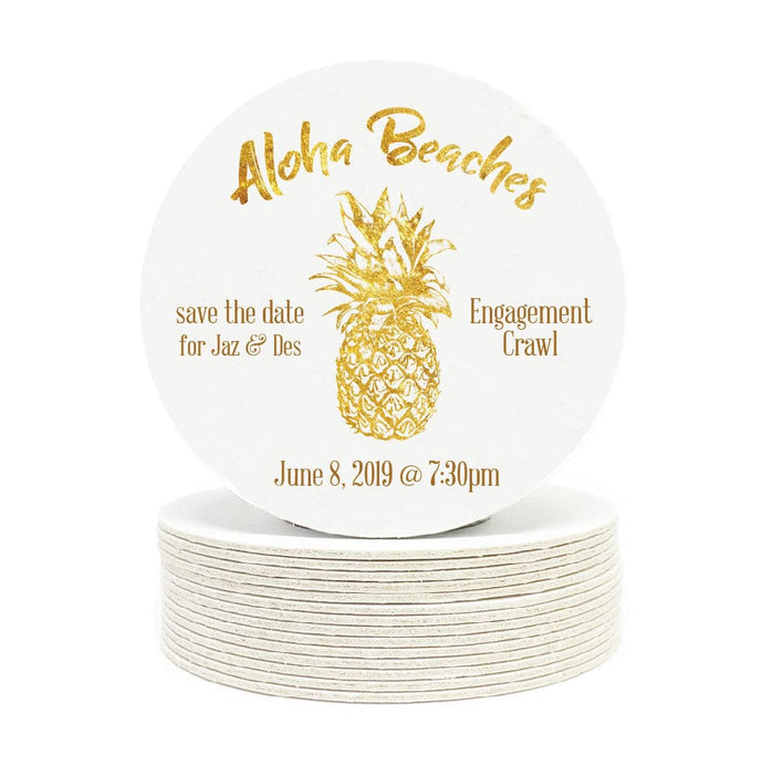 Single coaster is shown on top of a stack of coasters. Coasters are white and feature Aloha Beaches design. Design is printed with a gold texture and shows the words Aloha Beaches and has a pineapple on it. The words "save the date for Jaz & Des, Engagement Crawl, June 8, 2019 @ 7:30pm" can also been seen on the coaster.