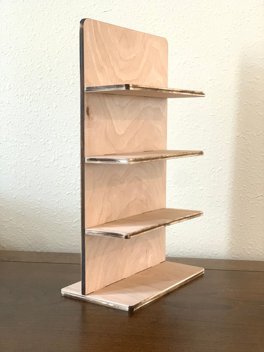 wooden glasses stand sitting on a wooden countertop