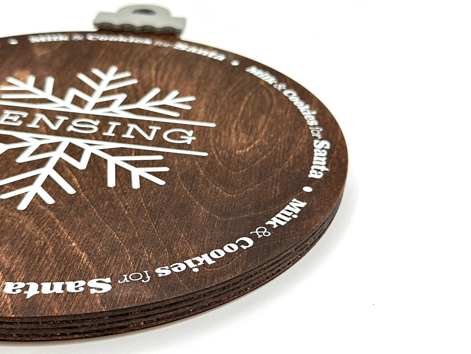 dark brown ornament cookie tray with snowflake design that says Rensing and Milk and cookies for Santa