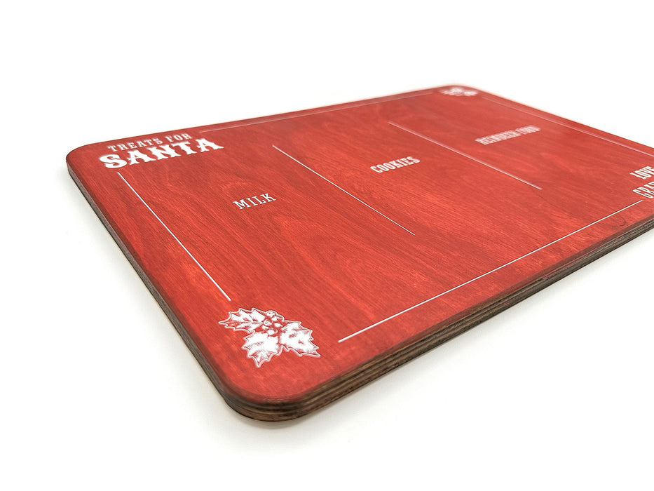 red treats for Santa wooden cookie tray that says Treats for Santa, Love Gray & Asher, and says Milk, Cookies, and Reindeer food, surrounded by holly leaf designs