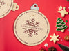 wooden ornament Christmas cookie tray with a snowflake design that says Lewandowski and Milk and Cookies for Santa on a red background surrounded by various holiday cookies