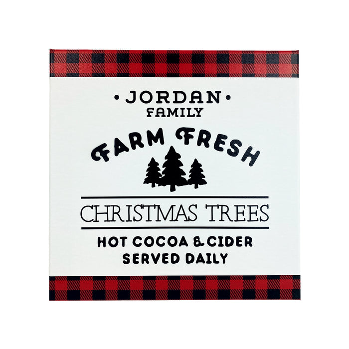 Canvas design with white background shown. Farm Fresh Christmas Trees design shown on canvas. Design has red and black plaid border with black text, Jordan Family Farm Fresh Christmas Trees Hot Cocoa & Cider Served Daily.