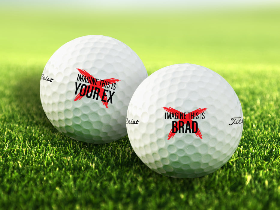 two golf balls on golf course grass with customizable designs that say imagine this is your ex