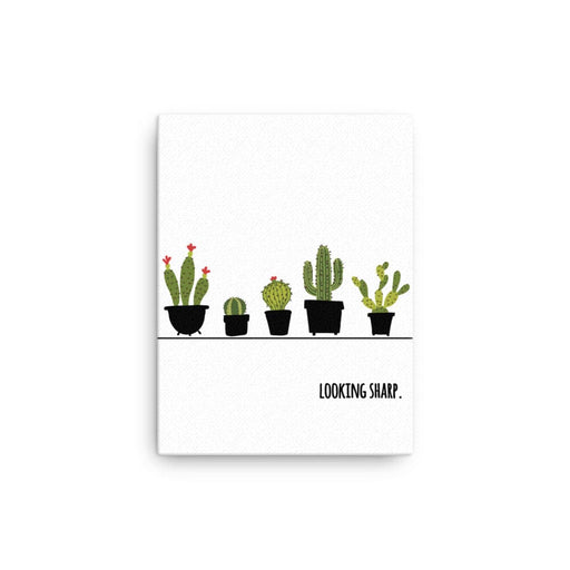 Canvas print with Looking Sharp design. Design features a variety of green cacti in pots with the words "Looking Sharp". Design is printed on a white canvas.