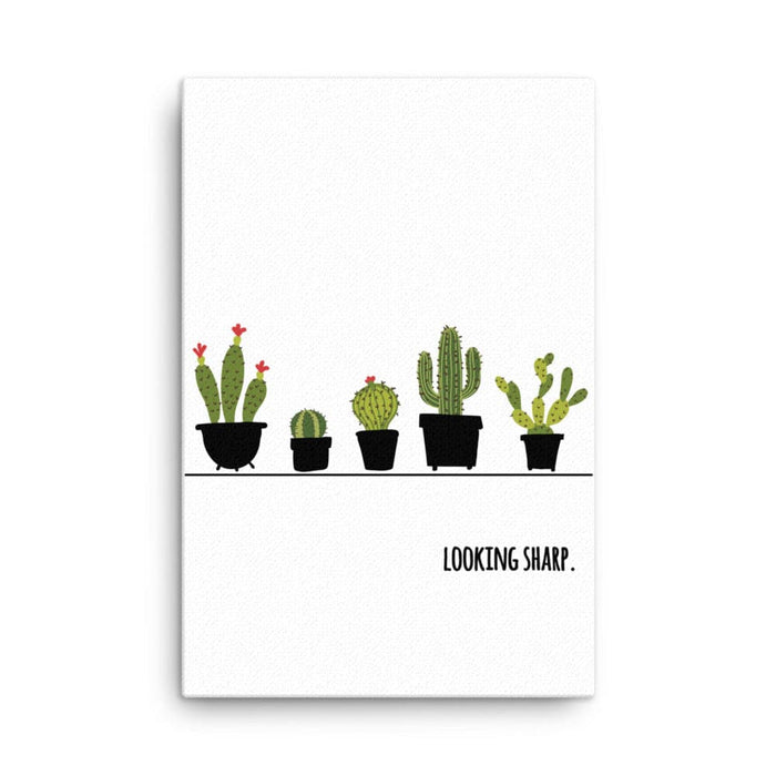 Canvas print with Looking Sharp design. Design features a variety of green cacti in pots with the words "Looking Sharp". Design is printed on a white canvas.