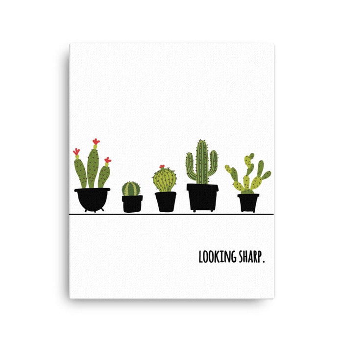 Canvas print with Looking Sharp design. Design features a variety of green cacti in pots with the words "Looking Sharp". Design is printed on a white canvas.