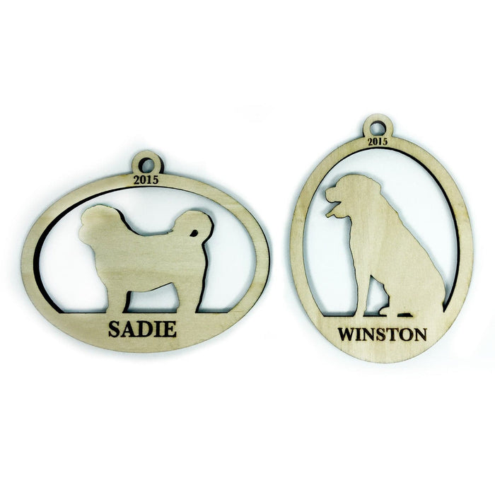 Ornaments shown on white background. Ornament design has a dog silhouette with the year and pet's name engraved on wooden ornament.