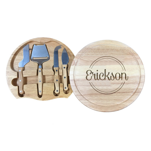 wooden cheeseboard with stainless steel cheese knives toolset with last name and initial engraving of the name Erickson surrounded by a circle and dots design