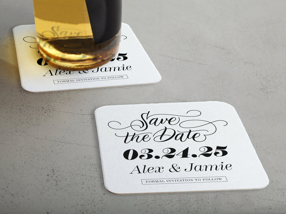 One coaster has a drink on it and an empty coaster sits beside it. Coasters say Save the Date, wedding date, married couple names, and formal invitation to follow.