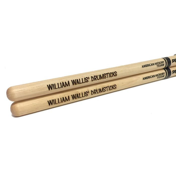 laser engraved wooden drum sticks that say William Wallis Drumsticks