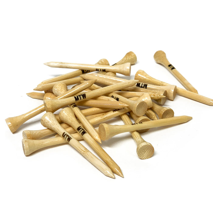 a pile of custom wooden golf tees that have MTW engraved on them