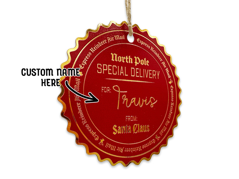 A hanging gold foil cardstock Santa gift tag is shown on a white surface. The text beside it reads, Custom Name Here.