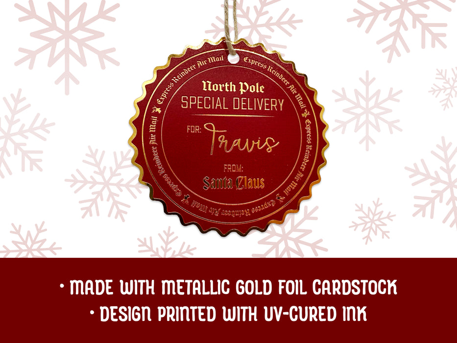 A gold foil cardstock hanging Santa gift tag is shown on a white background with red snowflakes. Text underneath the tag reads: Made with metallic gold foil cardstock, Design printed with UV-cured ink.