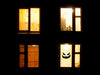 black scary pumpkin face on window at nighttime