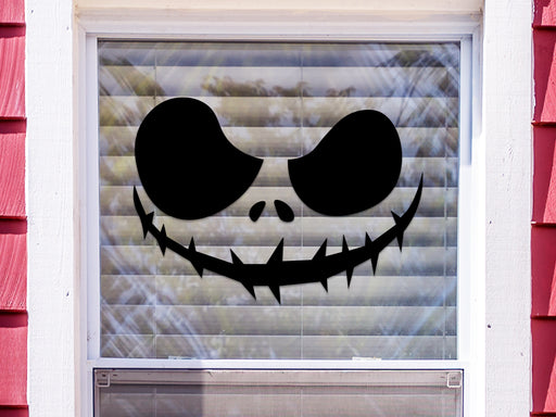 skeleton pumpkin face vinyl sticker placed outside of the window