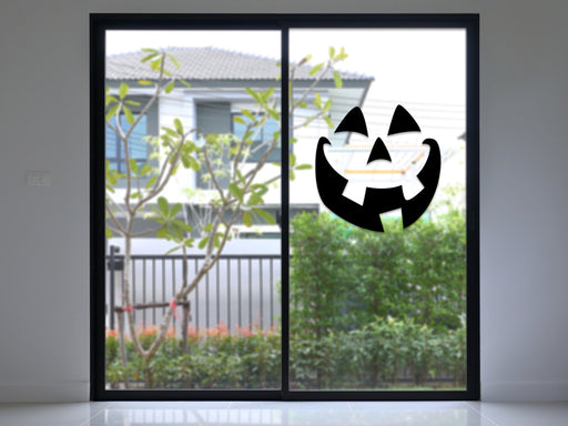 black smiley pumpkin face vinyl sticker on sliding glass door