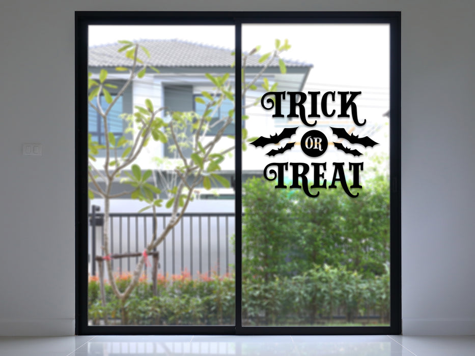 black trick or treat vinyl sticker on a sliding glass door