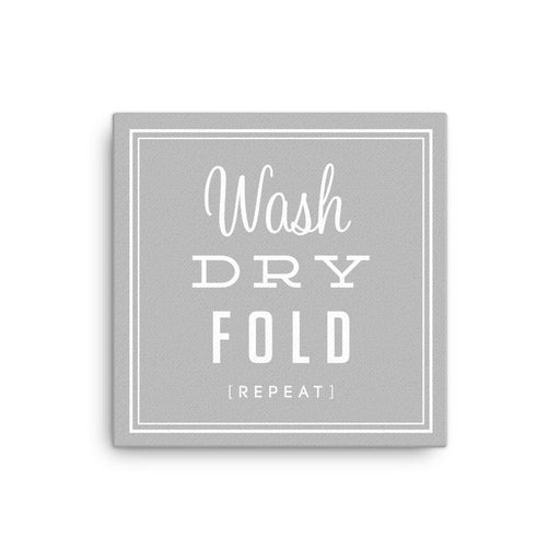 stretched canvas with a grey background that says Wash, Dry, Fold, Repeat