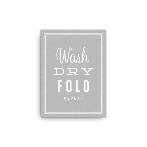 stretched canvas with a grey background that says Wash, Dry, Fold, Repeat